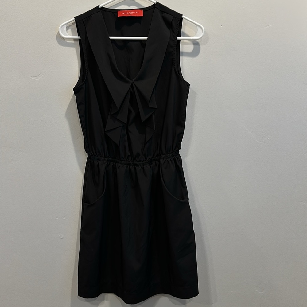 Akira black dress. Size M. Good condition. No flaws. Flutter front v-neck.